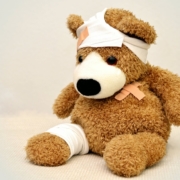 Teddy bear with bandages and plaster
