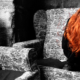 Depressed red haired woman sitting crumbled up in a chair