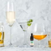 CBD oil and alcohol line up on a table