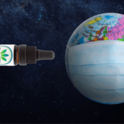 Globe with mask on and a CBD oil