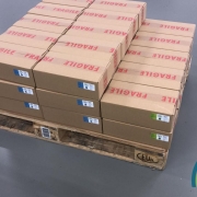 Boxes of The Real CBD oils on a pallet
