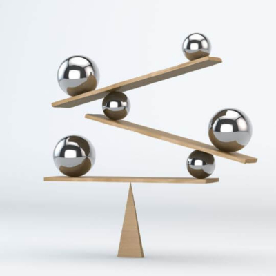 Metal balls balancing on wood plates and a triangle