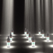 The Real CBD bottles in spotlight on stage