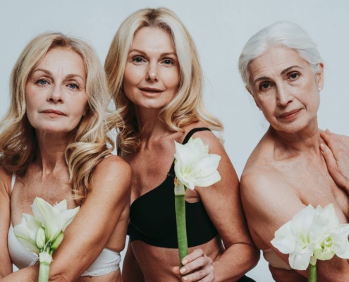 Middle-aged women holding white flowers