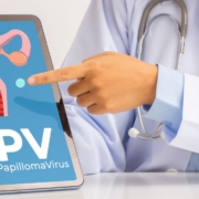 Doctor pointing on tablet with HPV uterus on it