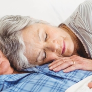 Old couple sleeping together