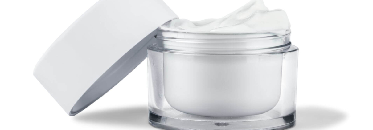 Jar with white crème close-up