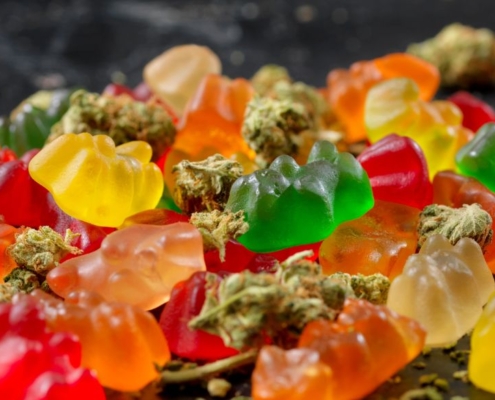 Gummy Bears and dried hemp flowers in a mix