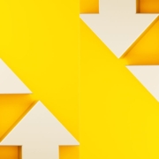 White arrows going up and down on a yellow background