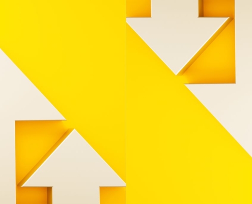 White arrows going up and down on a yellow background