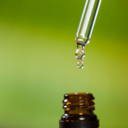 Pipette dripping liquid into bottle