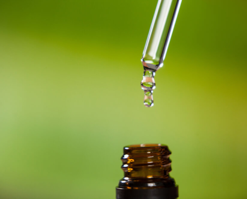 Pipette dripping liquid into bottle