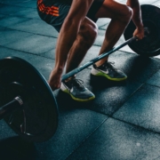 Athlete lifting a bar bell from the floor