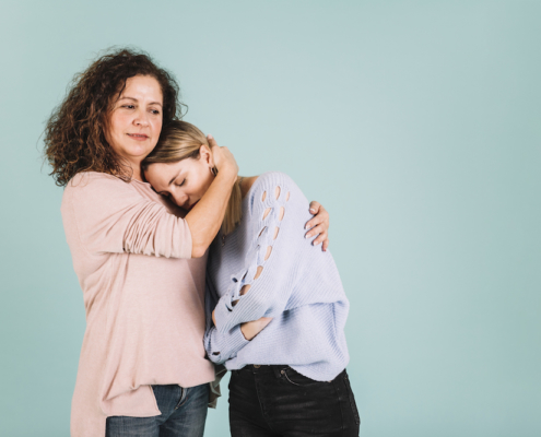 Mother comforting a teenager