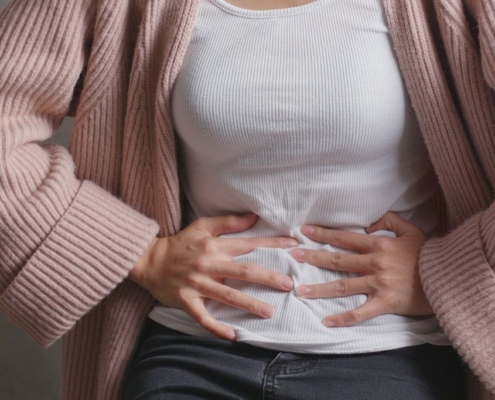 Woman holding her stomach