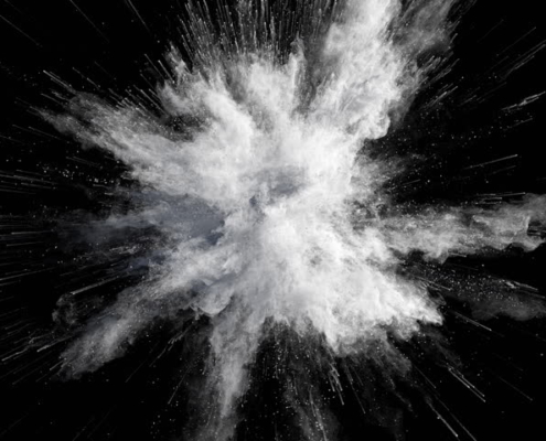 White powder exploding on a black background