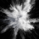 White powder exploding on a black background