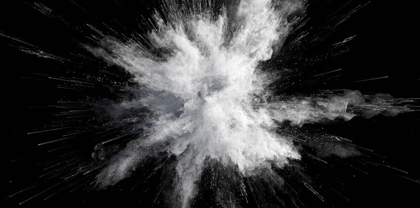 White powder exploding on a black background