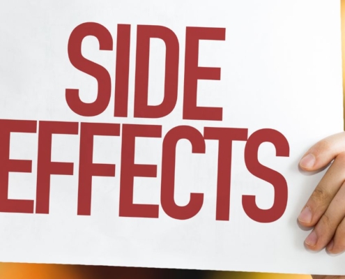 Hands holding SIDE EFFECT sign