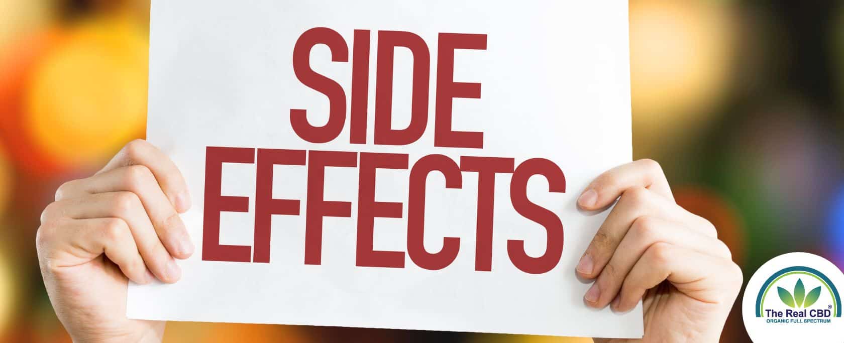 Hands holding SIDE EFFECT sign