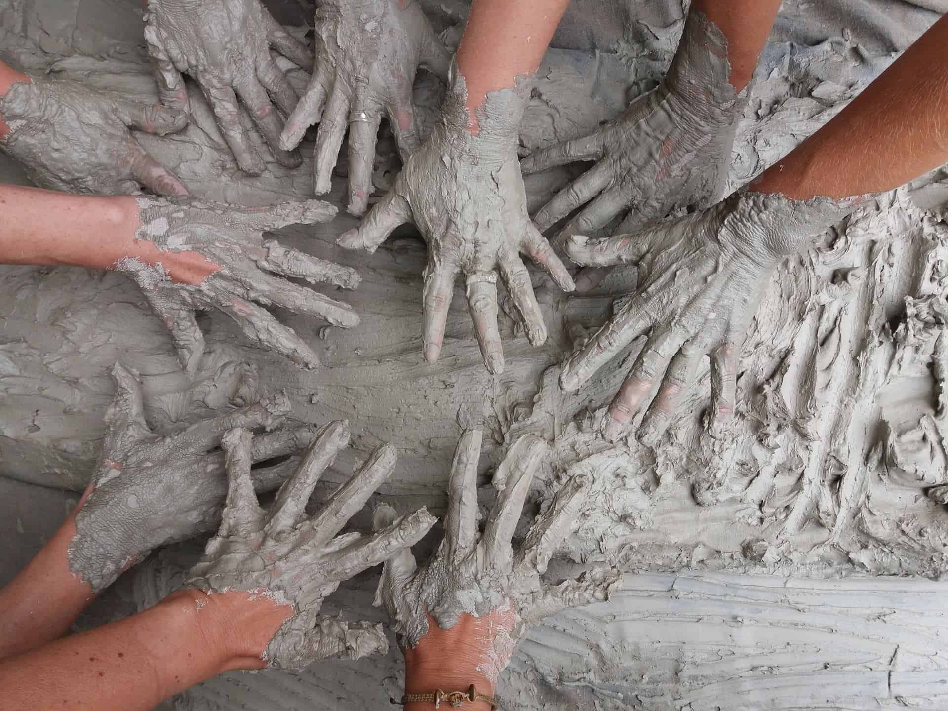 CBD Bentonite Clay hands in mudpile