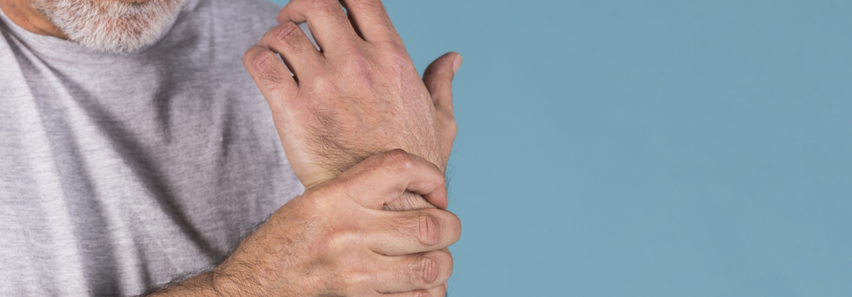 Man holding his wrist in pain