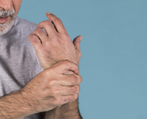 Man holding his wrist in pain