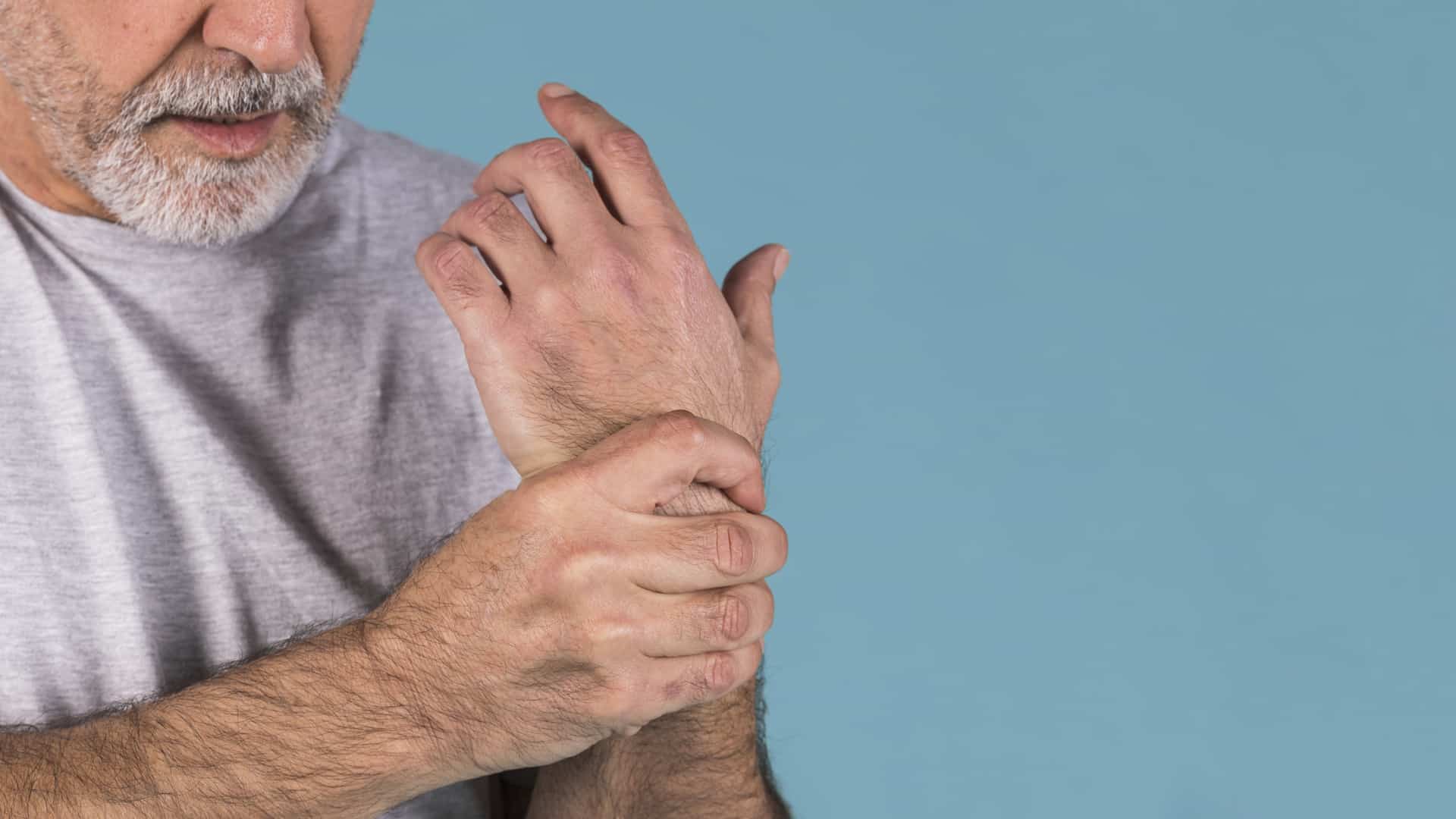 Man holding his wrist in pain