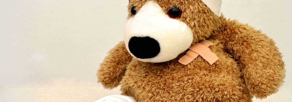 Teddy bear with bandages and plaster