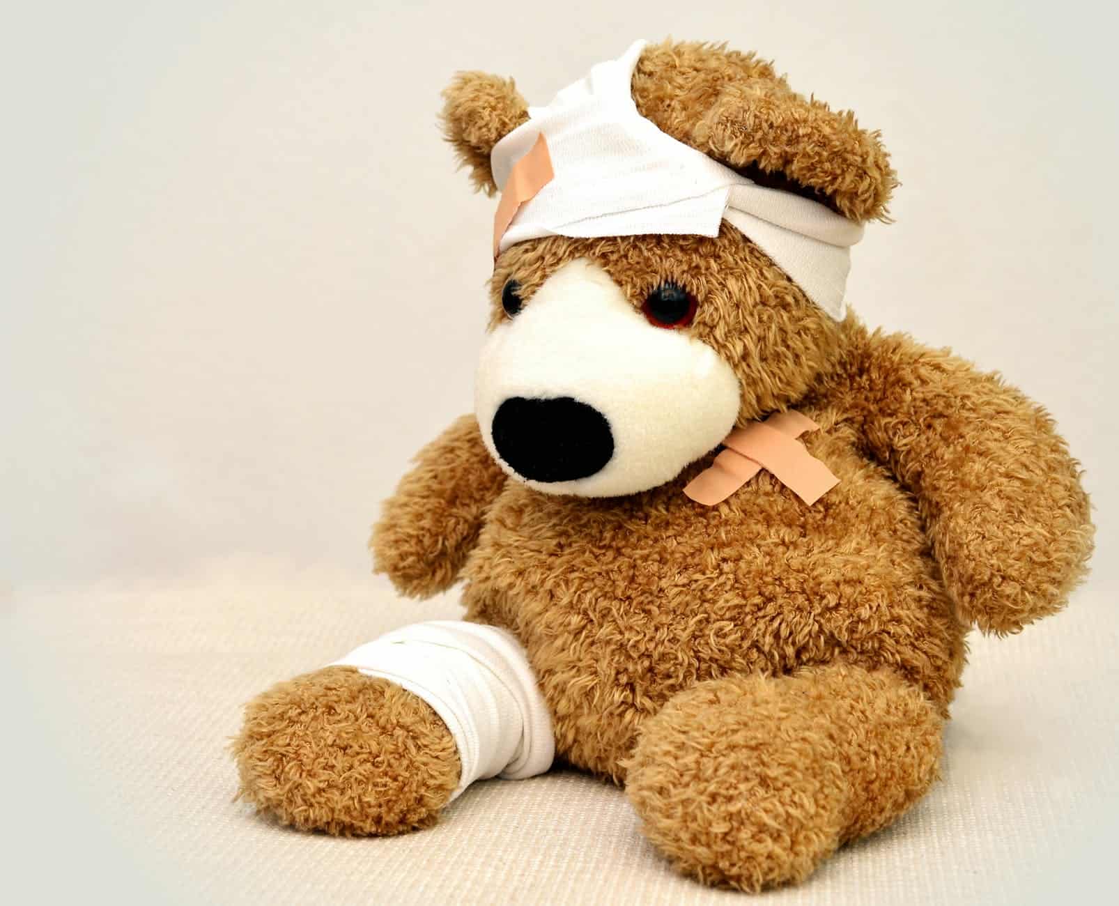 Teddy bear with bandages and plaster