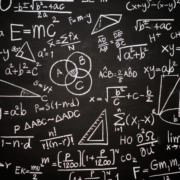 Blackboard with a mess of complicated formula written