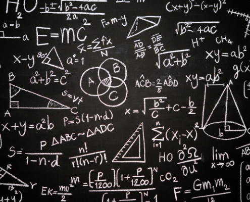 Blackboard with a mess of complicated formula written