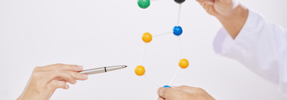 Scientists hand explaining, a plastic module of molecules