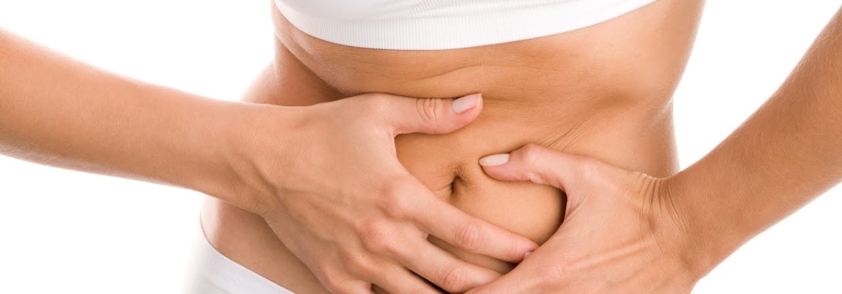 Woman holding her stomach in pain