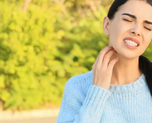 Woman itching her neck