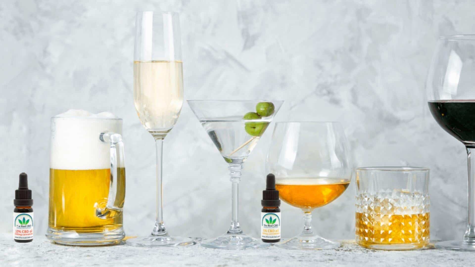 CBD oil and alcohol line up on a table