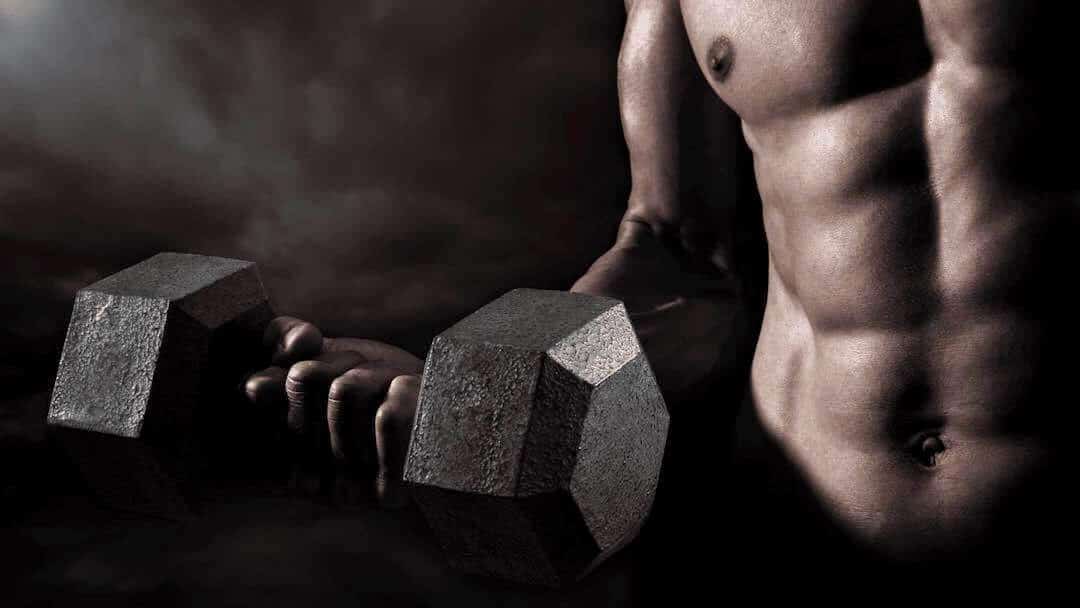 Muscular male with a dumbbell