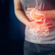 Man holding his stomach with intestines in red