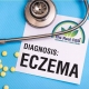 Eczema on a doctor's table with stethoscope and pills