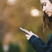 Teenager holding a smartphone