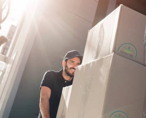 Man handling big cardboard boxes