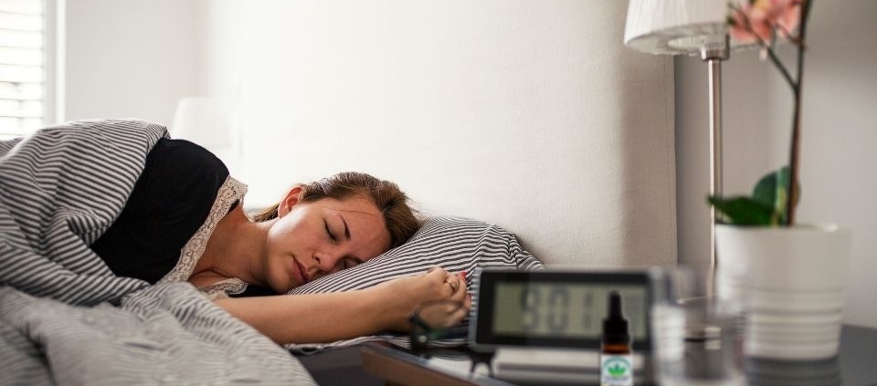 Woman asleep in light bedroom