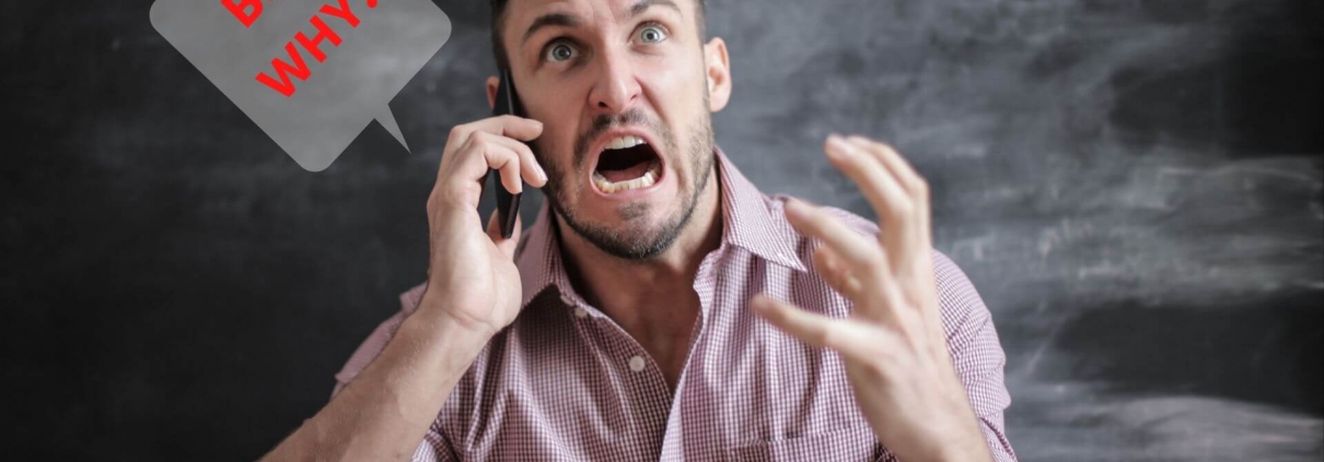 Man shouting BUT WHY on the phone