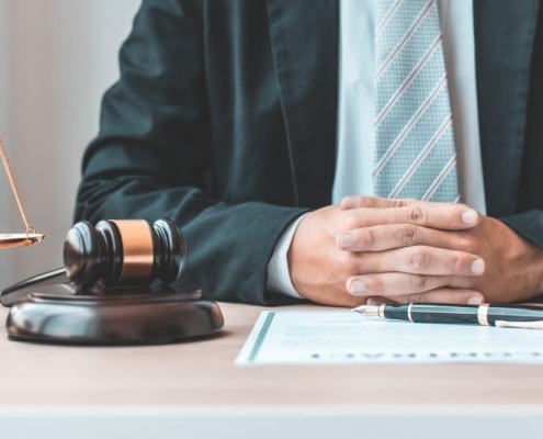 Lawyer with hammer and weight scale