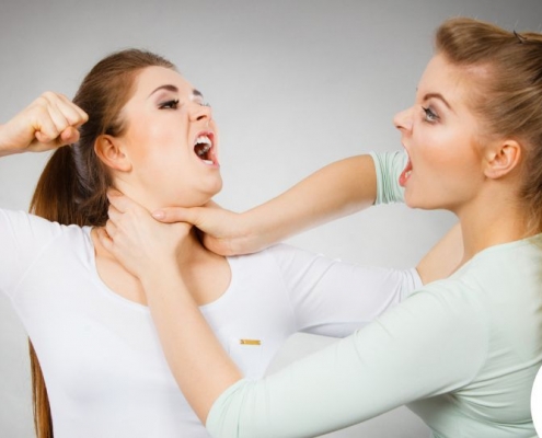 Two aggressive and angry women fighting