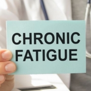 Doctor holding a chronic fatigue sign