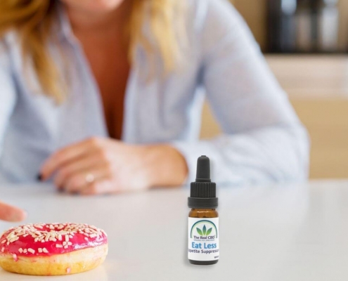 Woman reaching for a doughnut