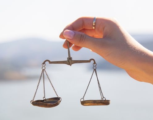 Hands holding an antique scale