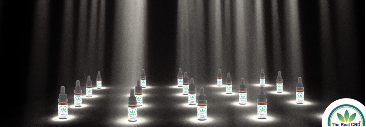 The Real CBD bottles in spotlight on stage