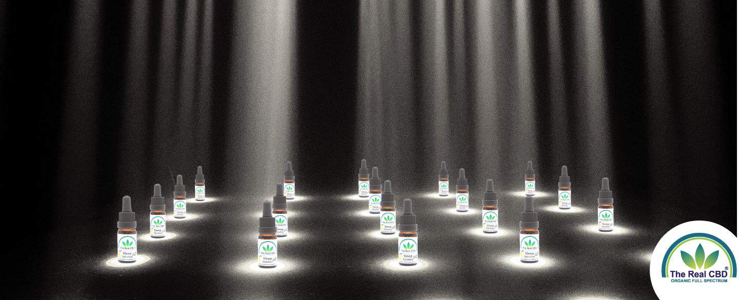 The Real CBD bottles in spotlight on stage